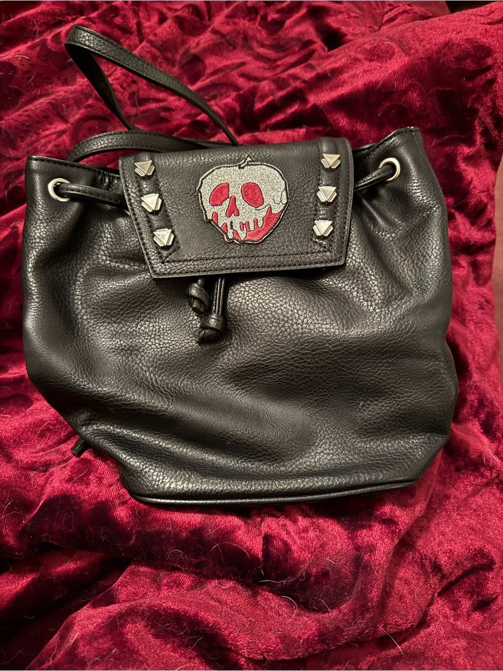 Danielle Nicole Studded Black Drawstring Backpack with Snow White Glitter Patch